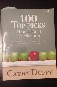 My well-loved copy of "100 Top Picks for Homeschool Curriculum" by Cathy Duffy