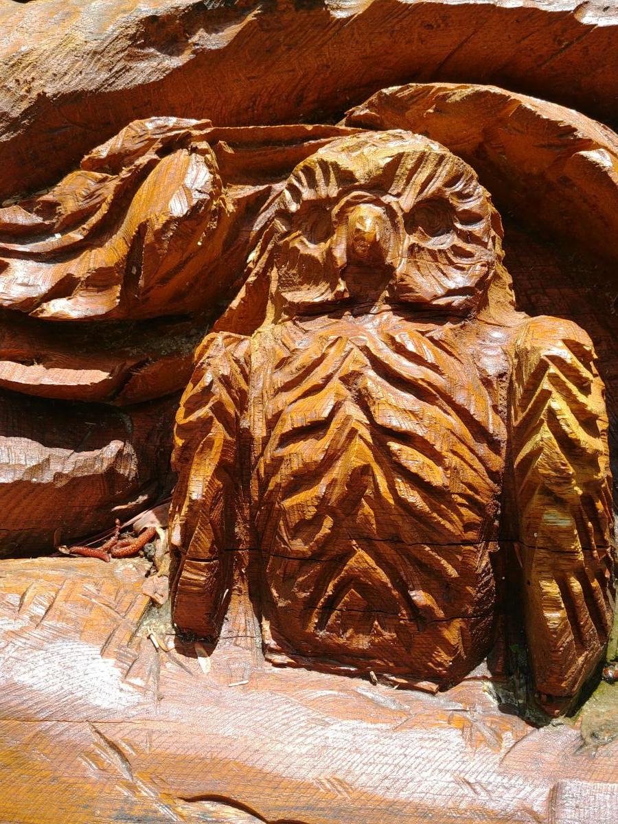 Owl on chainsaw art tree